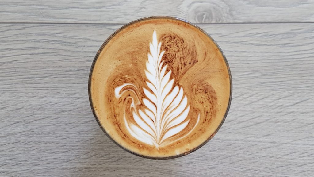 a Latte on a grey table