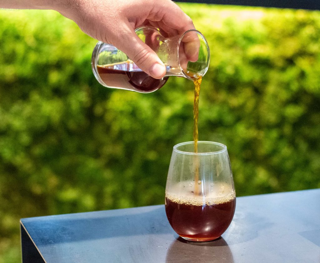 Coffee being poured into glass at Prototype Coffee