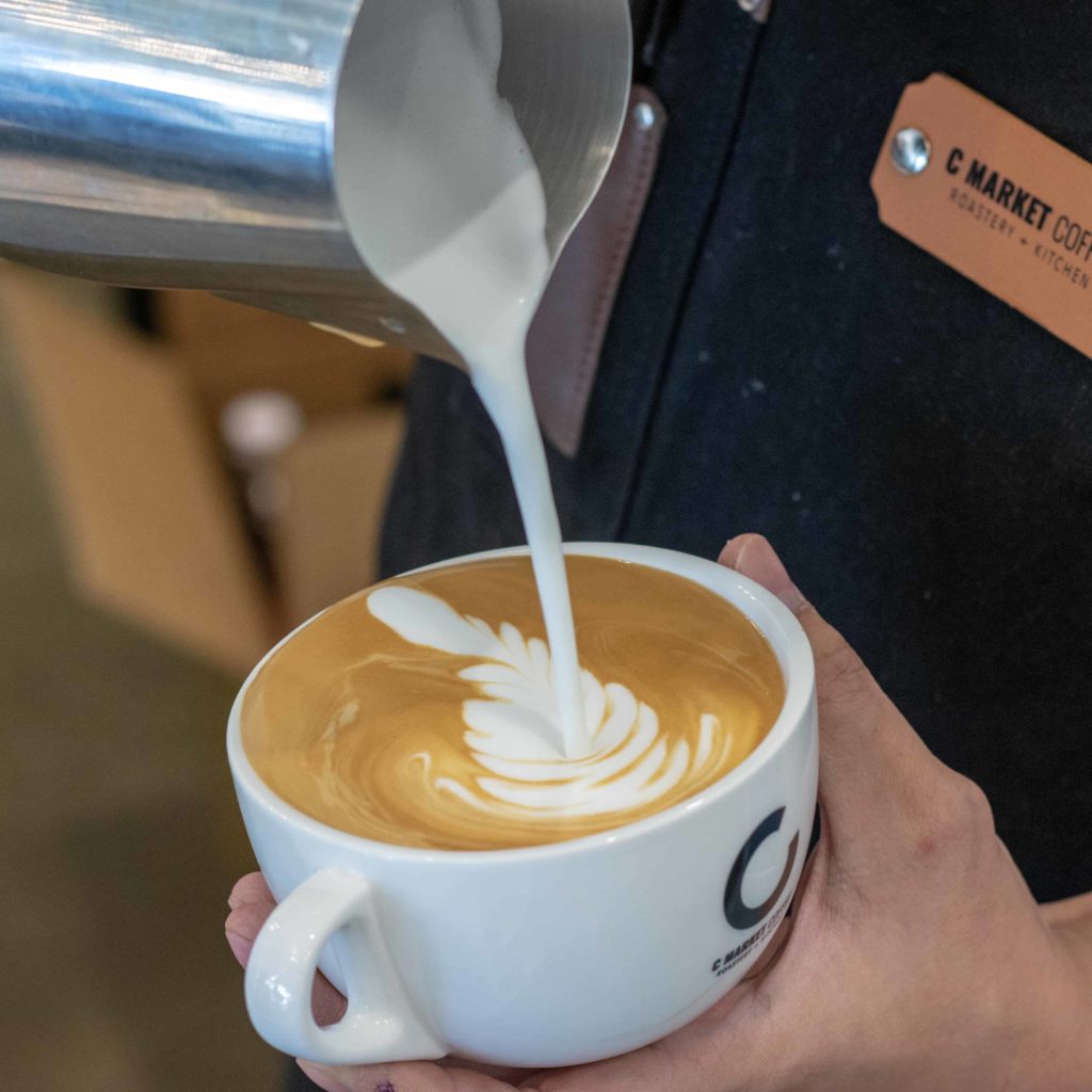 Latte Being Poured at C Market