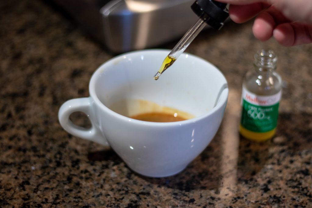 CBD Oil being dripped onto an espresso shot