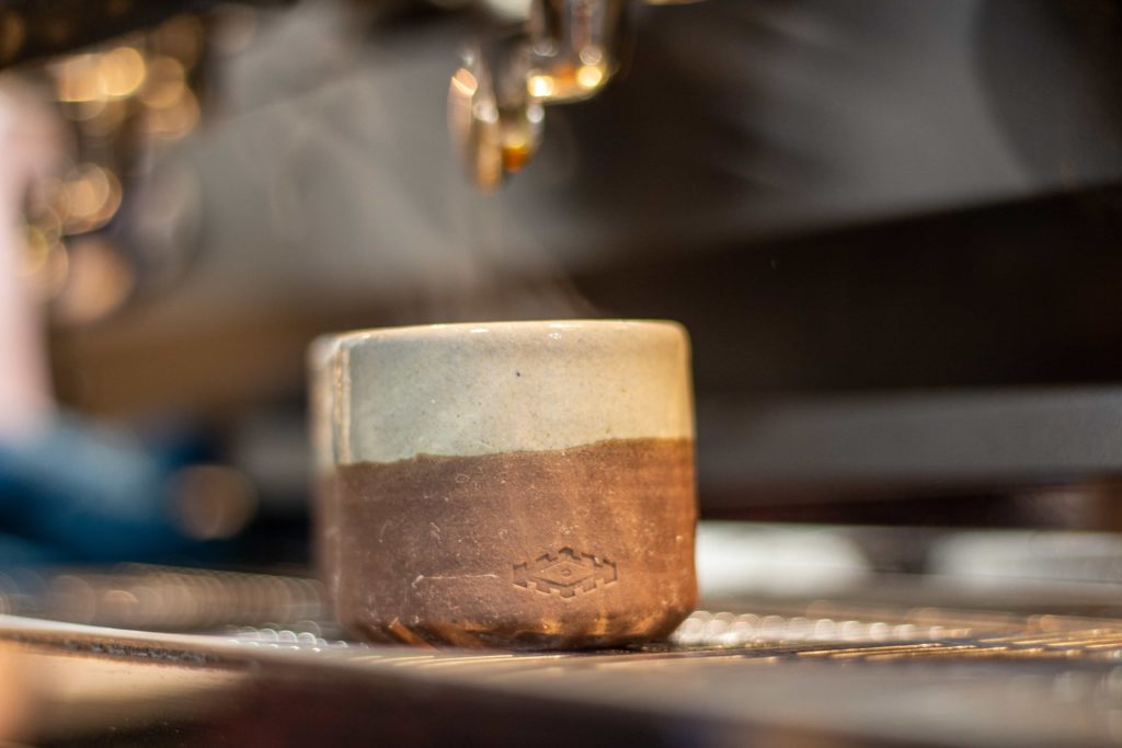 A hand made mug from Dustin Yu at Pallet Coffee Roasters HQ