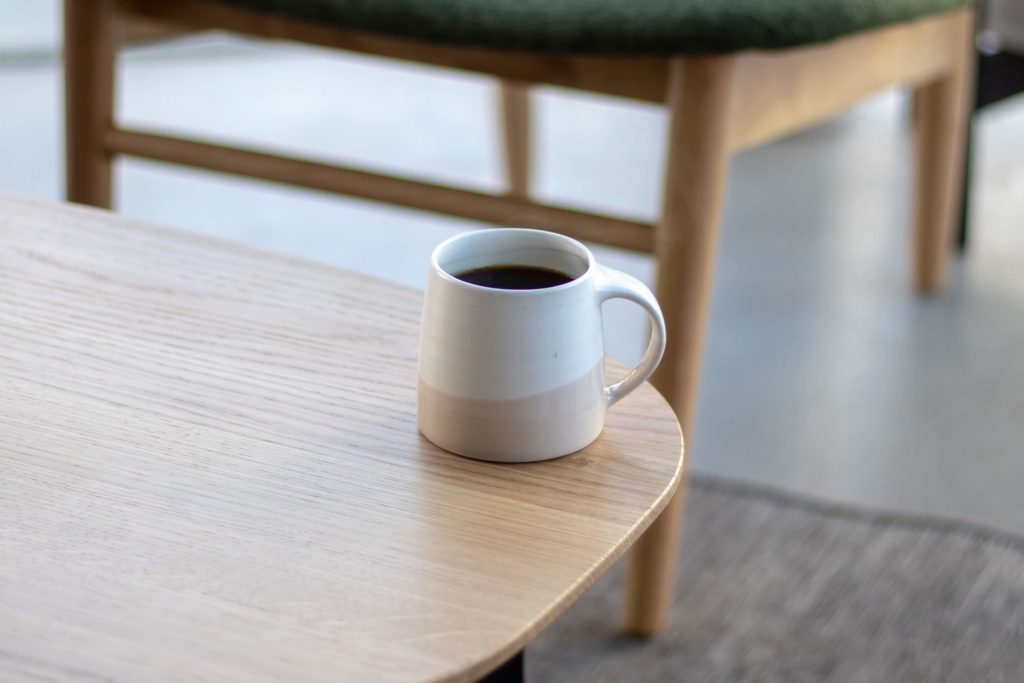 Batch brew coffee in cup on table