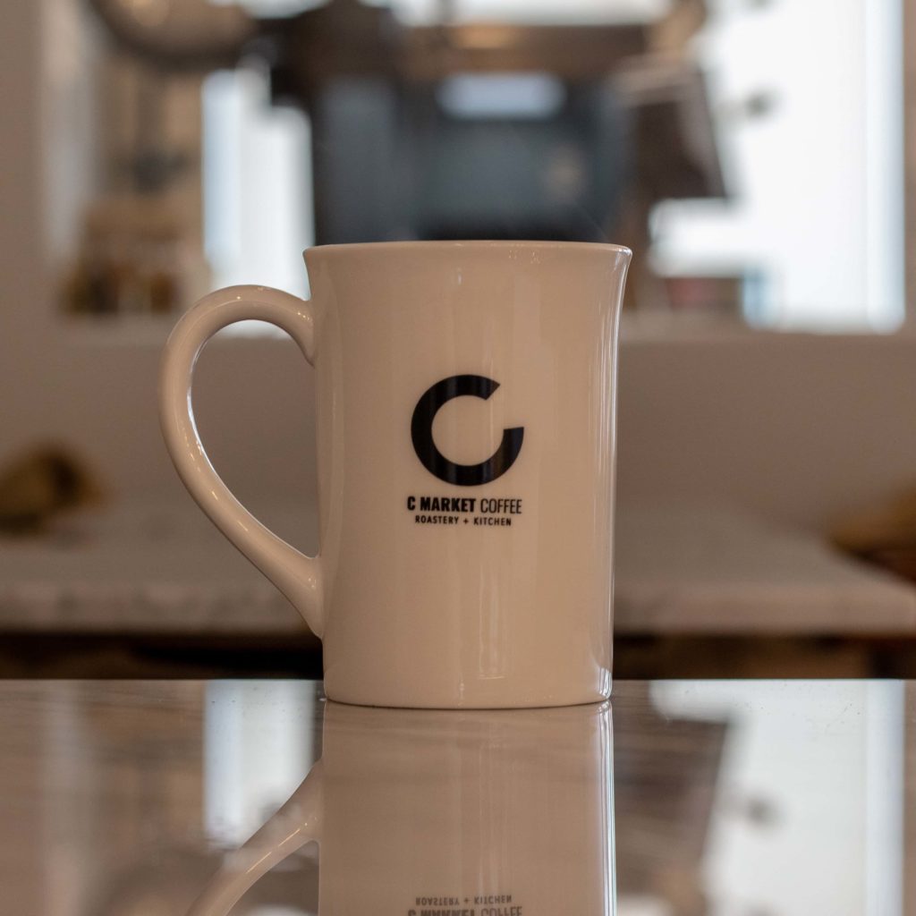 Cup with C logo on table