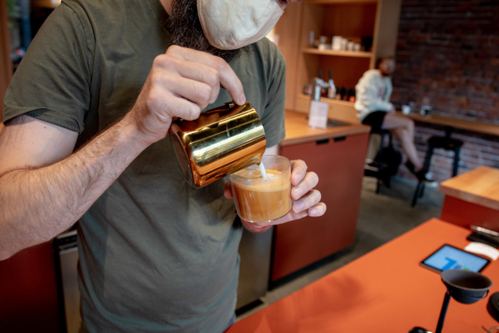 Eldric pouring a cortado