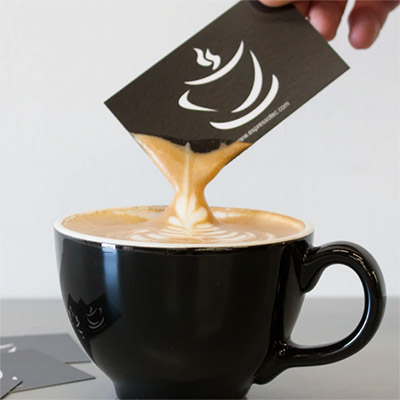 Card being dipped in latte